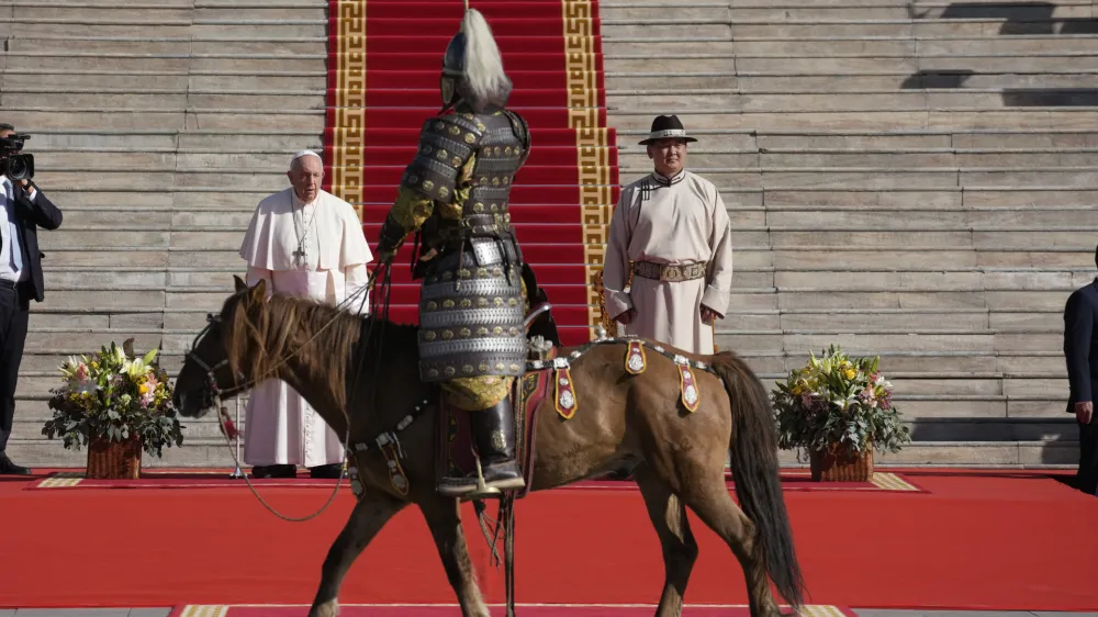 Mongolian President Ukhnaagin Khurelsukh, right, and Pope Francis meet, Saturday, Sept. 2, 2023, in front of the Saaral Ordon Government Building in Sukhbaatar Square in Ulaanbaatar. Pope Francis arrived in Mongolia on Friday morning for a four-day visit to encourage one of the world's smallest and newest Catholic communities. (AP Photo/Andrew Medichini)