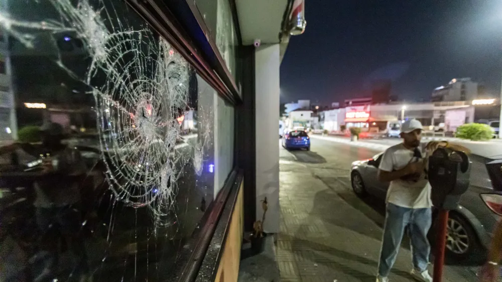 02 September 2023, Cyprus, Limassol: The store window is shattered as protesters attack a hair salon belonging to a migrant. Damages occurred during an anti-migrant protest, where police and protesters clashed. Photo: Kostas Pikoulas/ZUMA Press Wire/dpa