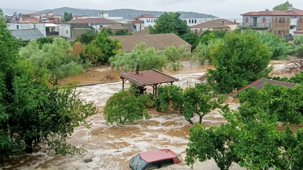 A car is submerged under water during a storm on mount Pelion, near Volos, Greece, September 5, 2023. Thanassis Kalliaras/Eurokinissi via REUTERS ATTENTION EDITORS - THIS PICTURE WAS PROVIDED BY A THIRD PARTY. NO RESALES. NO ARCHIVES. NO EDITORIAL SALES IN GREECE. GREECE OUT.