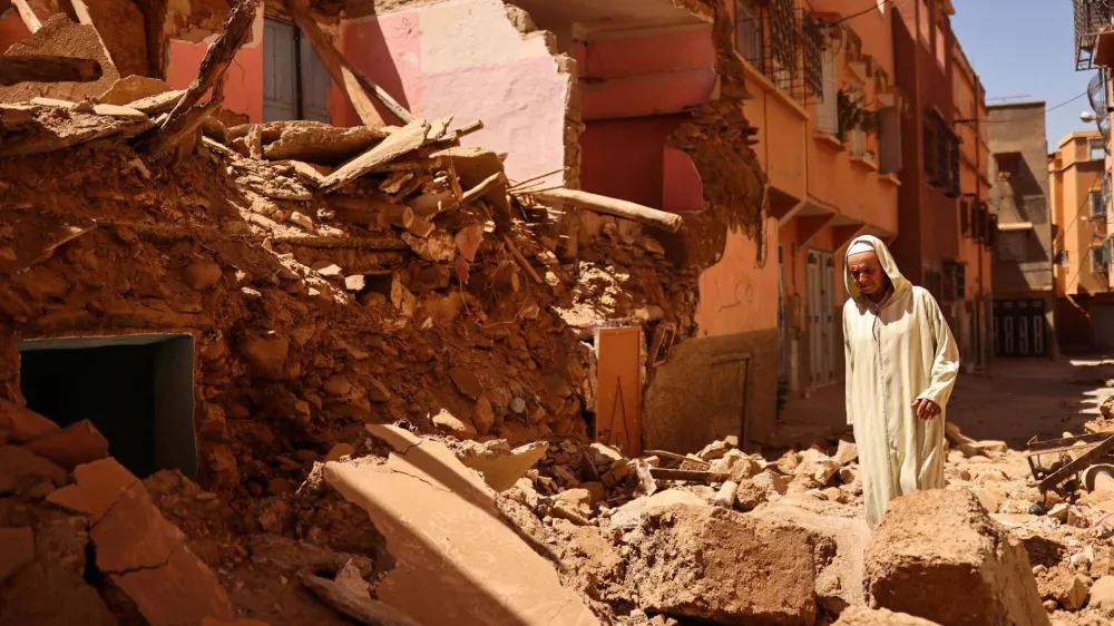 Mohamed Sebbagh, 66, stands in front of his destroyed house, in the aftermath of a deadly earthquake, in Amizmiz, Morocco, September 10, 2023. REUTERS/Nacho Doce   TPX IMAGES OF THE DAY