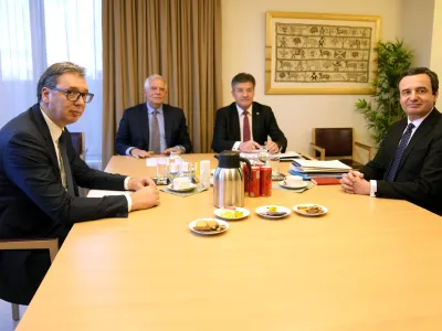 Serbian President Aleksandar Vucic, left, and Kosovo's Prime Minister Albin Kurti, right, meet with European Union foreign policy chief Josep Borrell, second left, in Brussels, Monday, Feb. 27, 2023. The leaders of Serbia and Kosovo are holding talks Monday on European Union proposals aimed at ending a long series of political crises and setting the two on the path to better relations and ultimately mutual recognition. (AP Photo/Virginia Mayo)