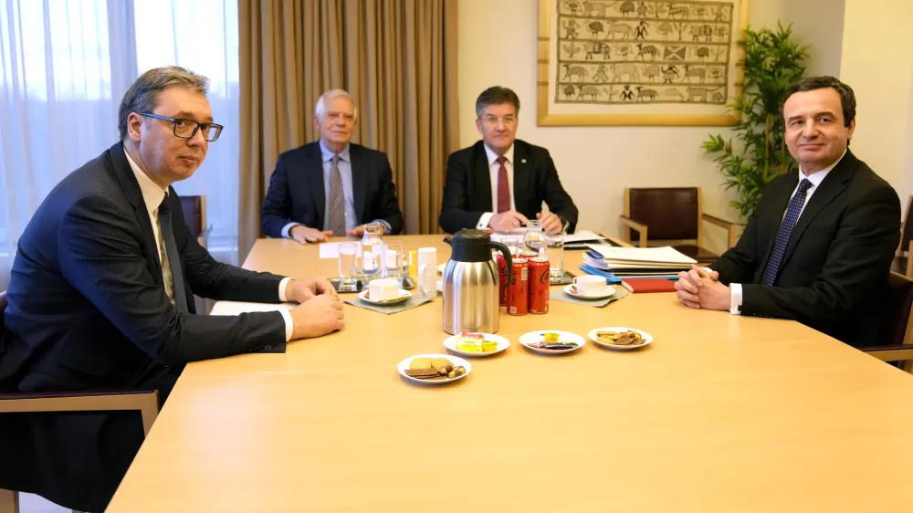 Serbian President Aleksandar Vucic, left, and Kosovo's Prime Minister Albin Kurti, right, meet with European Union foreign policy chief Josep Borrell, second left, in Brussels, Monday, Feb. 27, 2023. The leaders of Serbia and Kosovo are holding talks Monday on European Union proposals aimed at ending a long series of political crises and setting the two on the path to better relations and ultimately mutual recognition. (AP Photo/Virginia Mayo)