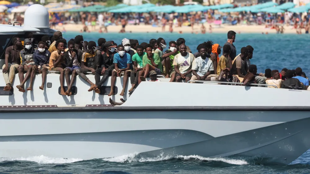 Migrants arrive on an Italian Coast Guard vessel after being rescued at sea, on the Sicilian island of Lampedusa, Italy, September 15, 2023. REUTERS/Yara Nardi