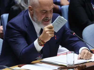 Albania's Prime Minister Edi Rama, serving as President of the United Nations Security Council, holds up a copy of the United Nations Charter in the midst of an exchange with Russia's Ambassador to the United Nations Vasily Nebenzya during a ministerial level meeting on the crisis in Ukraine at U.N. headquarters in New York, September 20, 2023. REUTERS/Mike Segar