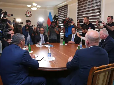 Azerbaijani representatives and members of the delegation of ethnic Armenians from Nagorno-Karabakh attend the talks in the town of Yevlakh, Azerbaijan September 21, 2023. REUTERS/Stringer NO RESALES. NO ARCHIVES