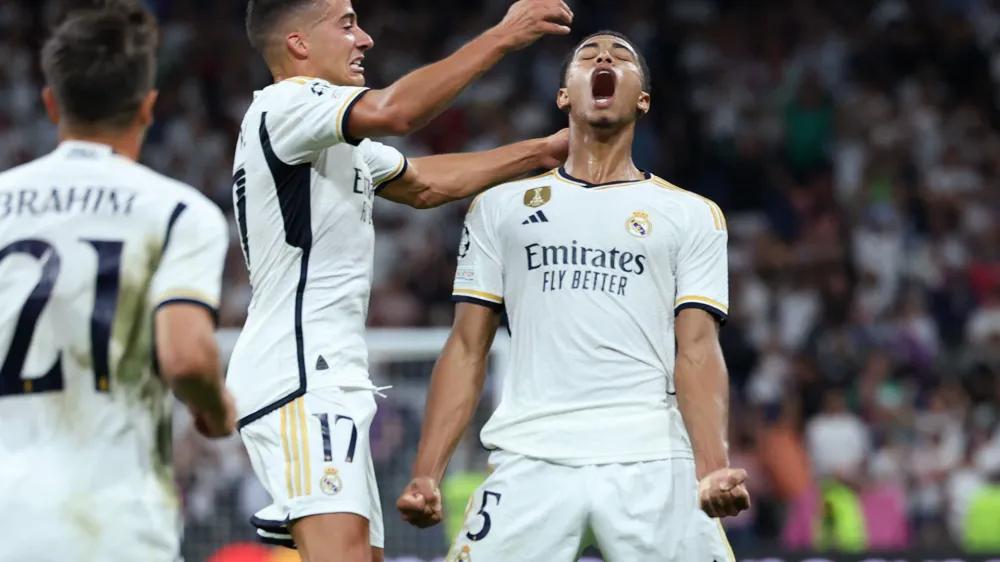 Soccer Football - Champions League - Group C - Real Madrid v 1. FC Union Berlin - Santiago Bernabeu, Madrid, Spain - September 20, 2023 Real Madrid's Jude Bellingham celebrates scoring their first goal with Lucas Vazquez REUTERS/Isabel Infantes
