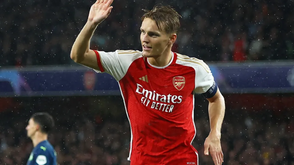 Soccer Football - Champions League - Group B - Arsenal v PSV Eindhoven - Emirates Stadium, London, Britain - September 20, 2023 Arsenal's Martin Odegaard celebrates scoring their fourth goal Action Images via Reuters/Paul Childs