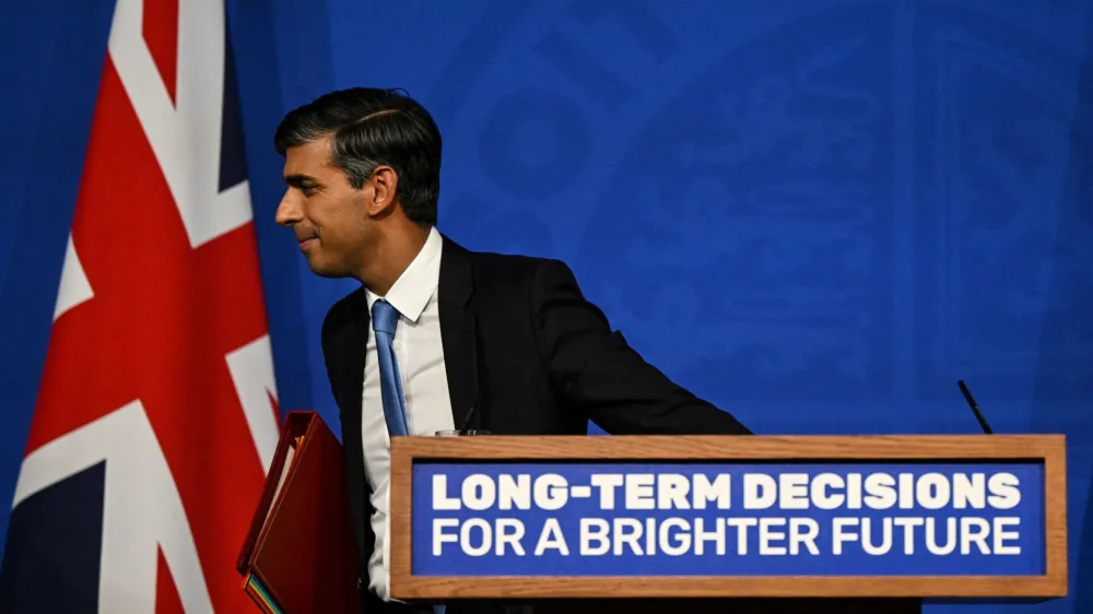 Britain's Prime Minister Rishi Sunak leaves the stage after delivers a speech during a press conference on the net zero target, at the Downing Street Briefing Room, in central London, on September 20, 2023. The UK looked set to backtrack on policies aimed at achieving net zero emissions by 2050 with Prime Minister Rishi Sunak expected to water down some of the government's green commitments. The move comes amid growing concern over the potential financial cost of the government's policies to achieve net zero carbon emissions by mid-century.   JUSTIN TALLIS/Pool via REUTERS