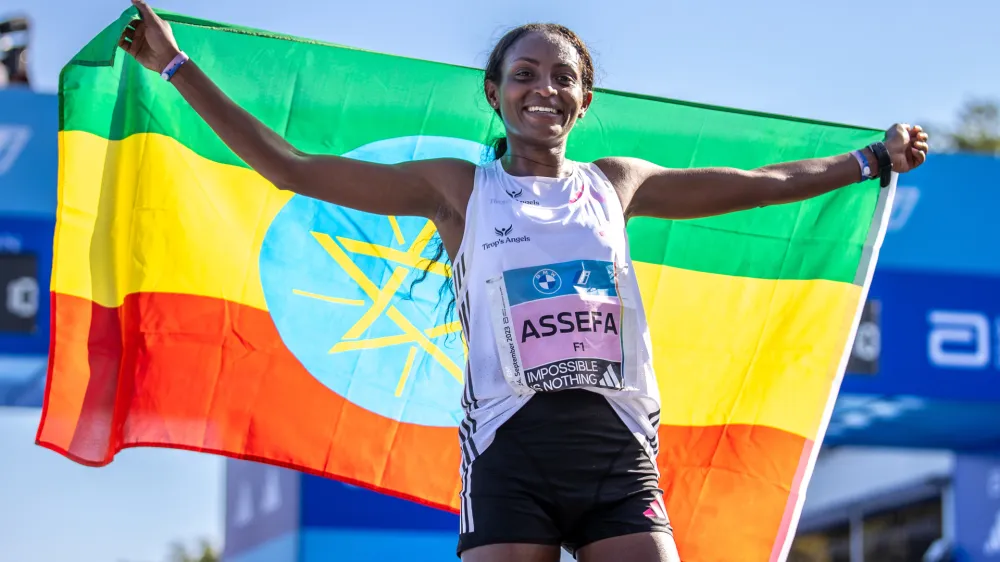 24 September 2023, Berlin: Ethiopian long-distance runner Tigst Assefa reacts after winning the BMW Berlin Marathon. Assefa betters the women's marathon world record to 2 hours 11 minutes 53 seconds in Berlin victory. Photo: Andreas Gora/dpa