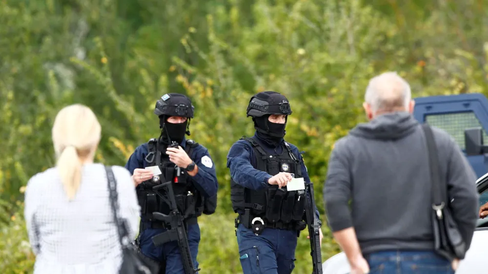 Kosovo police officers patrol on a road to Banjska monastery, in the aftermath of a shooting incident, near Zvecan, Kosovo September 25, 2023. REUTERS/Ognen Teofilovski