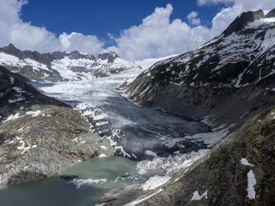 FILE - A lake of meltwater has formed on the tongue of the Rhone Glacier near Goms, Switzerland, on June 13, 2023. A Swiss Academy of Sciences panel is reporting a dramatic acceleration of glacier melt in the Alpine country, which has lost 10% of its ice volume in just two years after high summer heat and low snow volumes in winter. (AP Photo/Matthias Schrader, File)