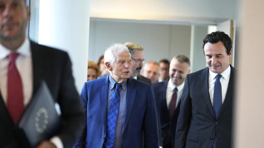 Kosovo's Prime Minister Albin Kurti, right, walks with European Union foreign policy chief Josep Borrell, center, prior to a meeting in Brussels, Thursday, Sept. 14, 2023. The leaders of Serbia and Kosovo are holding a fresh round of meetings on Thursday aimed at improving their strained relations as calls mount for a change in the Western diplomatic approach toward them amid concern that their tensions could spiral out of control. (AP Photo/Virginia Mayo)