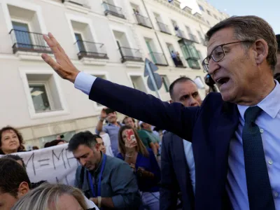 Spain's opposition People's Party leader Alberto Nunez Feijoo gestures to people as he leaves after losing the investiture vote at the parliament in Madrid, Spain, September 29, 2023. REUTERS/Susana Vera