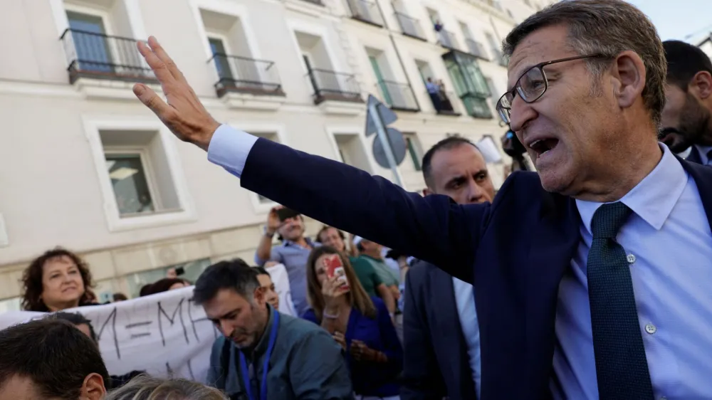 Spain's opposition People's Party leader Alberto Nunez Feijoo gestures to people as he leaves after losing the investiture vote at the parliament in Madrid, Spain, September 29, 2023. REUTERS/Susana Vera