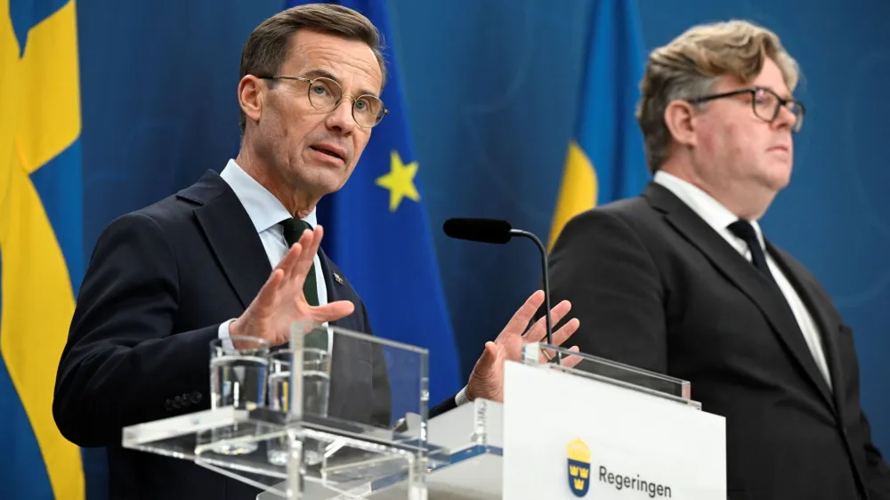 Sweden's Prime Minister Ulf Kristersson and Minister of Justice Gunnar Strommer attend a press conference after a meeting with National Police Chief Anders Thornberg, and Commander-in-Chief Micael Byden where they talked about the latest increase of gang related violence in Stockholm, Sweden, September 29, 2023. TT News Agency/Anders Wiklund via REUTERS   ATTENTION EDITORS - THIS IMAGE WAS PROVIDED BY A THIRD PARTY. SWEDEN OUT. NO COMMERCIAL OR EDITORIAL SALES IN SWEDEN.