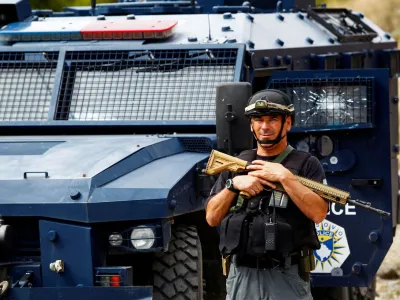 FILE PHOTO: A Kosovo police officer looks on, in the aftermath of a shooting incident, in Banjska village, Kosovo September 27, 2023. REUTERS/Ognen Teofilovski/File Photo