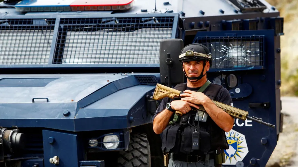 FILE PHOTO: A Kosovo police officer looks on, in the aftermath of a shooting incident, in Banjska village, Kosovo September 27, 2023. REUTERS/Ognen Teofilovski/File Photo