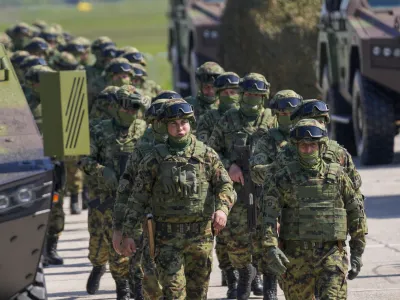 FILE - Serbian Army soldiers perform during a military exercise, at Batajnica Air Base near Belgrade, Serbia, on April 22, 2023. Serbia on Friday, June 23, 2023 reiterated the threat of an armed intervention in its former province of Kosovo, unless the NATO-led peacekeepers stationed there don't protect the minority Serbs there from "the great terror" of the Kosovo "regime." Serbian army chief-of-staff, Gen. Milan Mojsilovic, said that the military stands ready to fulfil its tasks "in accordance to the constitution" and orders from the army supreme commander, President Aleksandar Vucic. (AP Photo/Darko Vojinovic, File)