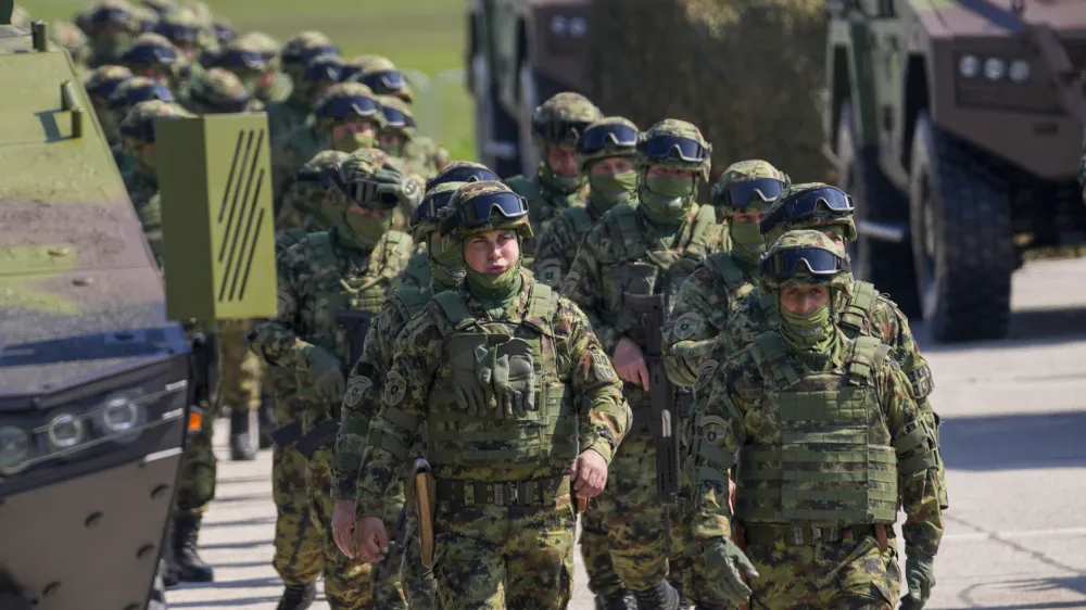 FILE - Serbian Army soldiers perform during a military exercise, at Batajnica Air Base near Belgrade, Serbia, on April 22, 2023. Serbia on Friday, June 23, 2023 reiterated the threat of an armed intervention in its former province of Kosovo, unless the NATO-led peacekeepers stationed there don't protect the minority Serbs there from "the great terror" of the Kosovo "regime." Serbian army chief-of-staff, Gen. Milan Mojsilovic, said that the military stands ready to fulfil its tasks "in accordance to the constitution" and orders from the army supreme commander, President Aleksandar Vucic. (AP Photo/Darko Vojinovic, File)