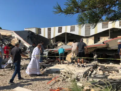 Members of security forces, people and a priest work at a site where a church roof collapsed during Sunday mass in Ciudad Madero, in Tamaulipas state, Mexico in this handout picture distributed to Reuters on October 1, 2023. Secretaria de Seguridad Publica Tamaulipas/Handout via REUTERS THIS IMAGE HAS BEEN SUPPLIED BY A THIRD PARTY. NO RESALES. NO ARCHIVES