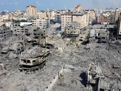 FILE PHOTO: A view shows houses and buildings destroyed by Israeli strikes in Gaza City, October 10, 2023. REUTERS/Mohammed Salem/File Photo