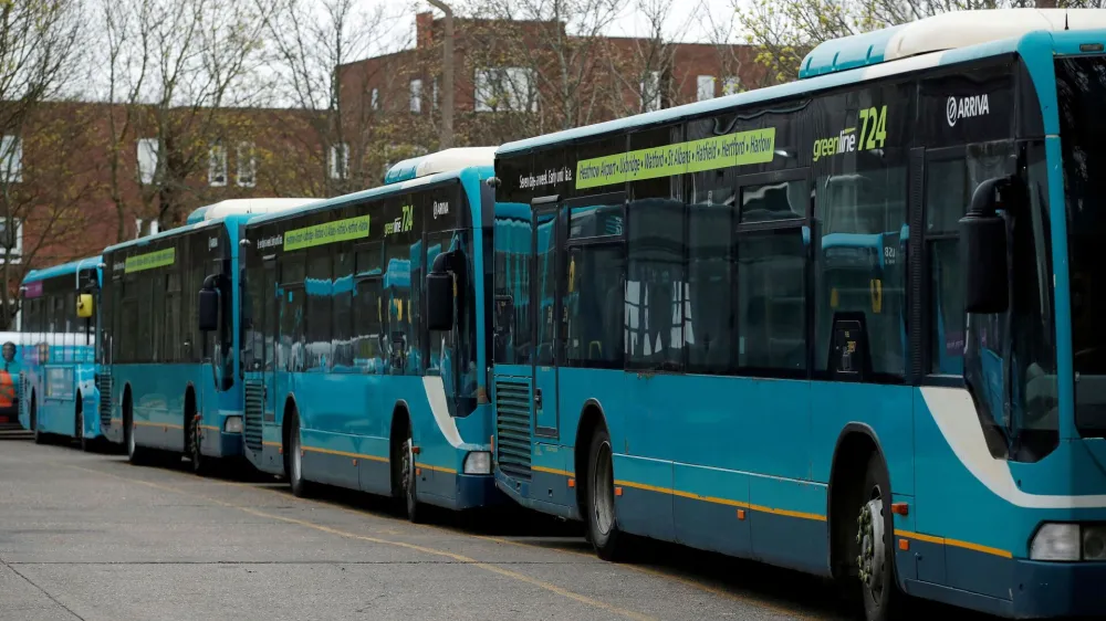 FILE PHOTO: FILE PHOTO: Parked buses are seen at an Arriva bus depot in Harlow, Britain, April 3, 2020. REUTERS/Andrew Couldridge/File Photo