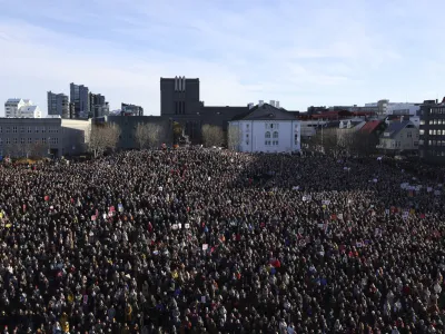 People across Iceland gather during the women's strike in Reykjavik, Iceland, Tuesday, Oct. 24, 2023. Iceland's prime minister and women across the island nation are on strike to push for an end to unequal pay and gender-based violence. (AP Photo/Arni Torfason)