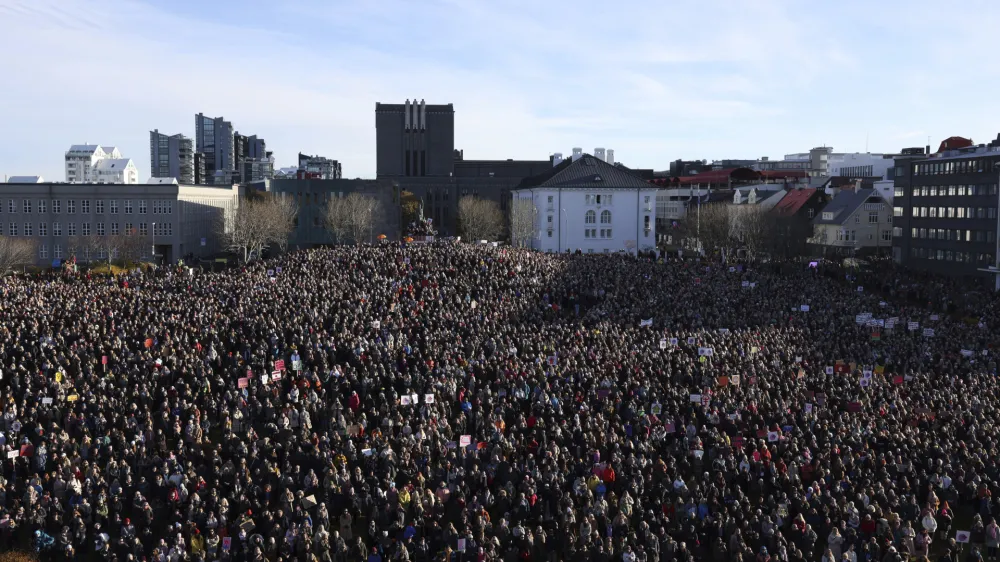 People across Iceland gather during the women's strike in Reykjavik, Iceland, Tuesday, Oct. 24, 2023. Iceland's prime minister and women across the island nation are on strike to push for an end to unequal pay and gender-based violence. (AP Photo/Arni Torfason)