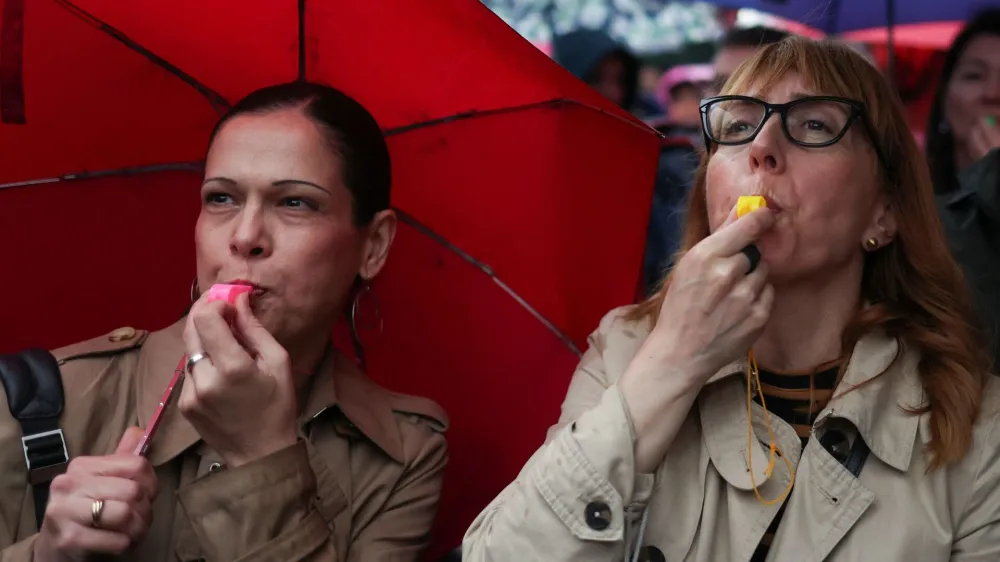 Women use whistles during a protest "Serbia against violence" in reaction to the two mass shootings in the same week, that have shaken the country, in Belgrade, Serbia, May 27, 2023. REUTERS/Marko Djurica