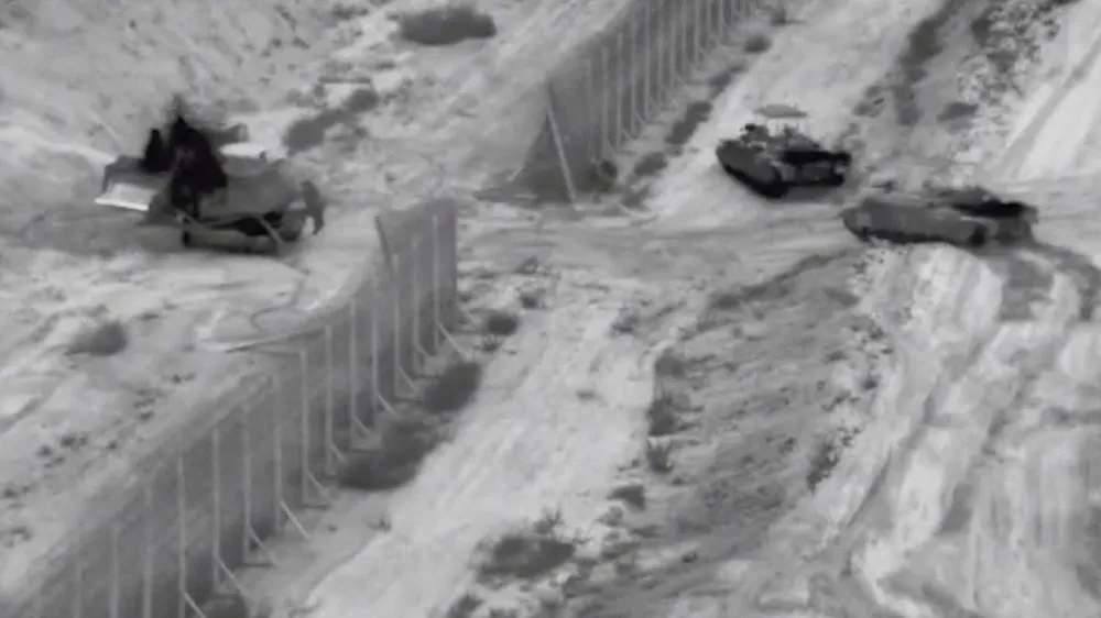 Israeli armoured vehicles take part in an operation, as the conflict between Israel and Hamas continues, at a location given as the northern Gaza Strip in this still image taken from handout video released October 26, 2023.   Israel Defense Forces/Handout via REUTERS  THIS IMAGE HAS BEEN SUPPLIED BY A THIRD PARTY   TPX IMAGES OF THE DAY