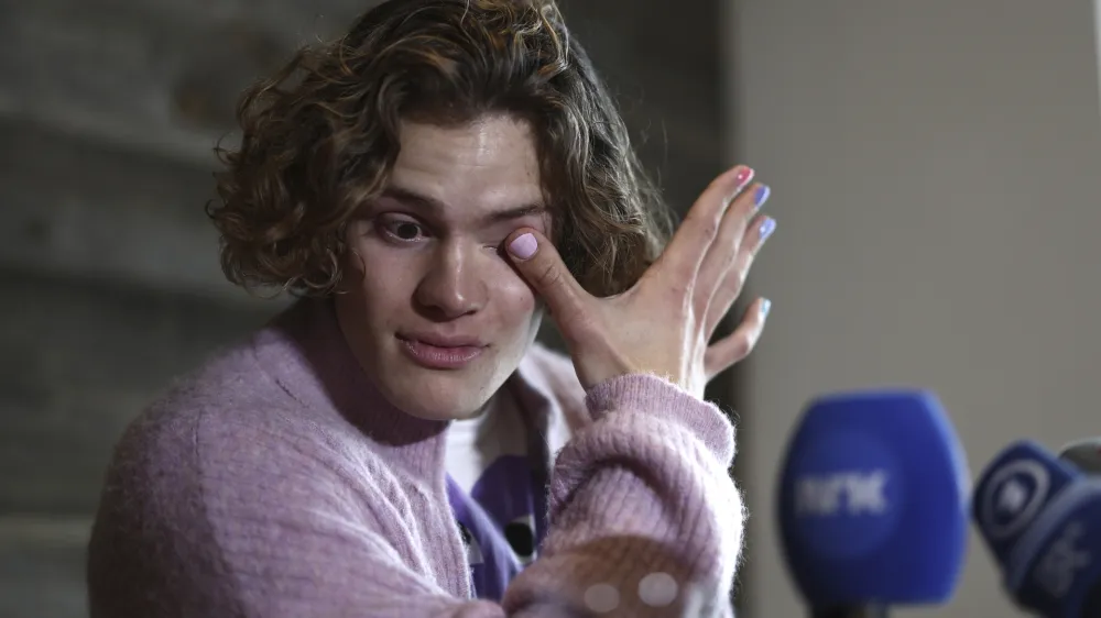 Norway's Lucas Braathen wipes his tears during a press conference in Soelden, Austria, Friday, Oct. 27, 2023. (AP Photo/Gabriele Facciotti)