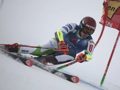 Slovenia's Zan Kranjec speeds down the course during the first run of an alpine ski, men's World Cup giant slalom race, in Soelden, Austria, Sunday, Oct. 29, 2023. (AP Photo/Gabriele Facciotti)