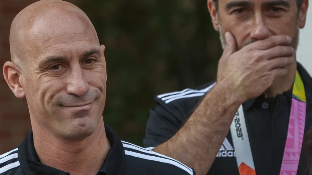 FILE - President of Spain's soccer federation, Luis Rubiales, left, stands next to Spain Head Coach Jorge Vilda after their World Cup victory at La Moncloa Palace in Madrid, Spain, Tuesday, Aug. 22, 2023. FIFA has banned ousted former Spanish soccer federation president Luis Rubiales from the sport for three years. He was judged for misconduct at the Women's World Cup final where he forcibly kissed a player on the lips at the trophy ceremony. FIFA did not publish details of the verdict reached by its disciplinary committee judges. (AP Photo/Manu Fernandez, File)