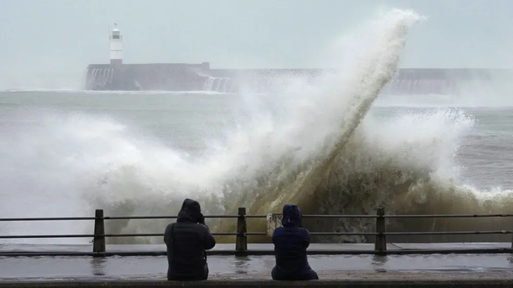 Waves crash over Newhaven Lighthouse and the harbour wall in Newhaven, southern England, Thursday, Nov. 2, 2023. Winds up to 180 kilometers per hour (108 mph) slammed France's Atlantic coast overnight as Storm Ciaran lashed countries around western Europe, uprooting trees, blowing out windows and leaving 1.2 million French households without electricity Thursday. Strong winds and rain also battered southern England and the Channel Islands, where gusts of more than 160 kph (100 mph) were reported. (AP Photo/Kin Cheung)