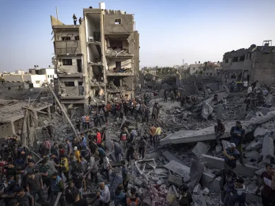 Palestinians look for survivors of the Israeli bombardment in the Maghazi refugee camp in the Gaza Strip, Sunday, Nov. 5, 2023. (AP Photo/Fatima Shbair)