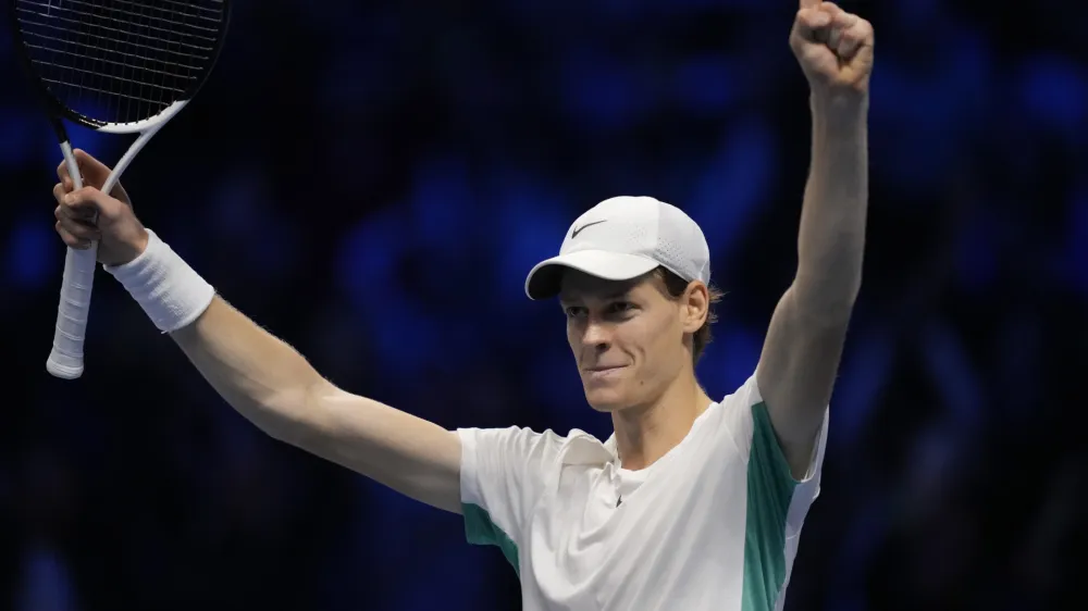 Italy's Jannik Sinner celebrates after winning the singles tennis match against Serbia's Novak Djokovic, of the ATP World Tour Finals at the Pala Alpitour, in Turin, Italy, Tuesday, Nov. 14, 2023. (AP Photo/Antonio Calanni)