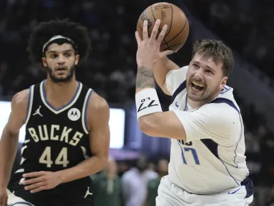 Dallas Mavericks' Luka Doncic gets past Milwaukee Bucks' Andre Jackson Jr. during the first half of an NBA basketball game Saturday, Nov. 18, 2023, in Milwaukee. (AP Photo/Morry Gash)