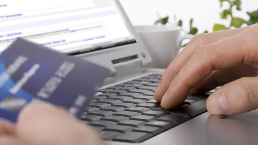 Online shopping using a credit card to complete an e-commerce transaction