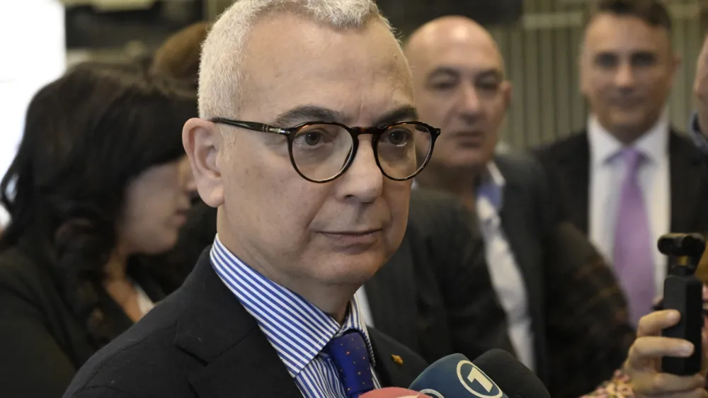 Vincenzo Capomolla, deputy prosecutor of Catanzaro, talks to reporters at the end of the reading of the verdicts of a maxi-trial of hundreds of people accused of membership in Italy's 'ndrangheta organized crime syndicate, one of the world's most powerful, extensive and wealthy drug-trafficking groups, in Lamezia Terme, southern Italy, Monday, Nov. 20, 2023. Verdicts are expected Monday for the trial that started almost three years ago in the southern Calabria region, where the mob organization was originally based. (AP Photo/Valeria Ferraro)