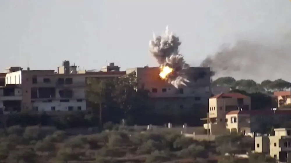 Smoke and fire rise from a building following an Israeli strike on what the Israeli military says are Hezbollah targets in a location given as Lebanon, amid the ongoing cross-border hostilities between Hezbollah and Israeli forces, in this screengrab taken from an undated handout video released on November 24, 2023. Israel Defense Forces/Handout via REUTERS THIS IMAGE HAS BEEN SUPPLIED BY A THIRD PARTY