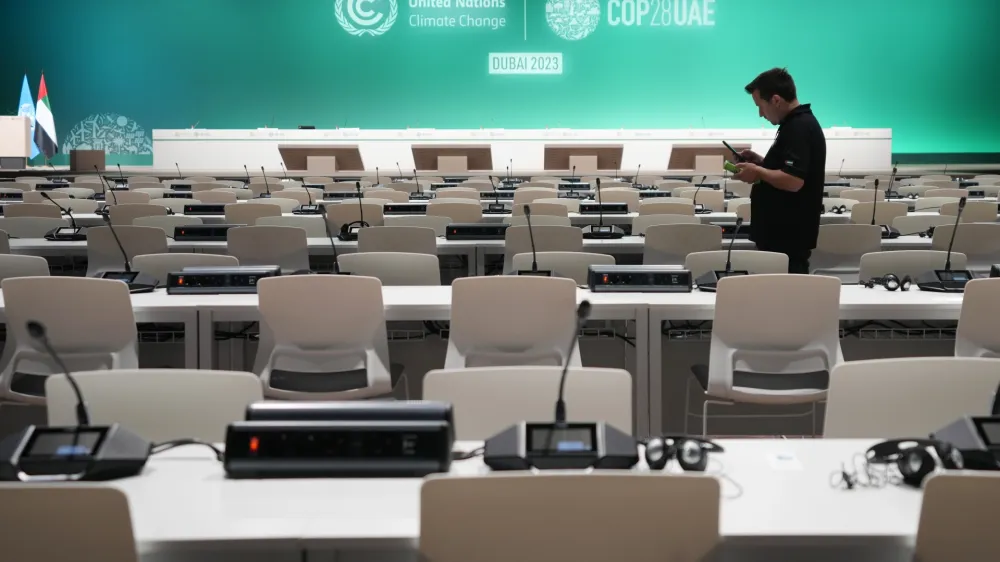 A worker sets up ahead of the COP28 U.N. Climate Summit, Wednesday, Nov. 29, 2023, in Dubai, United Arab Emirates. (AP Photo/Kamran Jebreili)