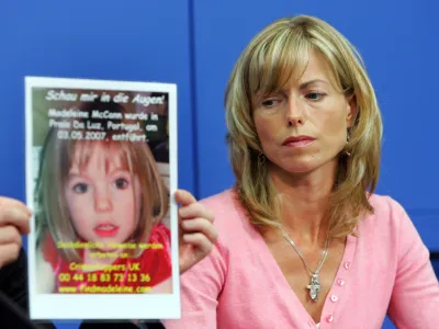 BERLIN - JUNE 06: Kate Mc Cann, the mother of the missing 4-year-old British girl Madeleine McCann looks at a poster showing her missing daughter during a press conference on June 6, 2007 in Berlin, Germany. Kate and her husband Gerry are in Berlin to spread the word in the search for their missing duaghter Madeleine who disappeared from their holiday apartment in Praia da Luz, Portugal on May 3, 2007. (Photo by Miguel Villagran/Getty Images)