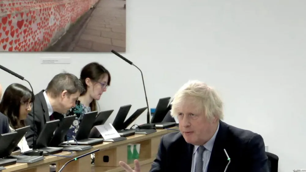 Former British Prime Minister Boris Johnson gives evidence at the COVID-19 Inquiry, in London, Britain, December 6, 2023 in this screen grab obtained from a handout video. UK Covid-19 Inquiry/Handout via REUTERS ATTENTION EDITORS - THIS IMAGE HAS BEEN SUPPLIED BY A THIRD PARTY. NO RESALES. NO ARCHIVES. MANDATORY CREDIT