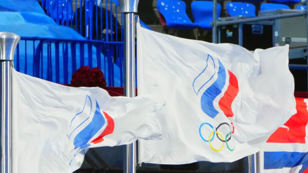 FILED - 20 February 2022, China, Beijing: The flag of the Russian Olympic Committee flies in the stadium. Individual Russian and Belarusian athletes will be allowed to take part in the 2024 Olympic Games in Paris as neutral athletes, the International Olympic Committee has ruled. Photo: Michael Kappeler/dpa