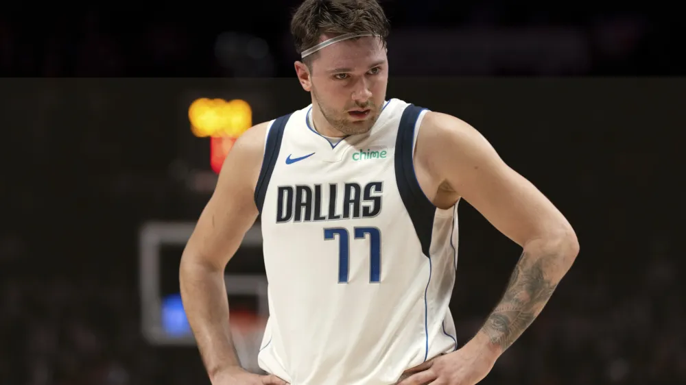 Dallas Mavericks guard Luka Doncic looks to the sideline during the second half of the team's NBA basketball game against the Portland Trail Blazers on Friday, Dec. 8, 2023, in Portland, Ore. (AP Photo/Howard Lao)