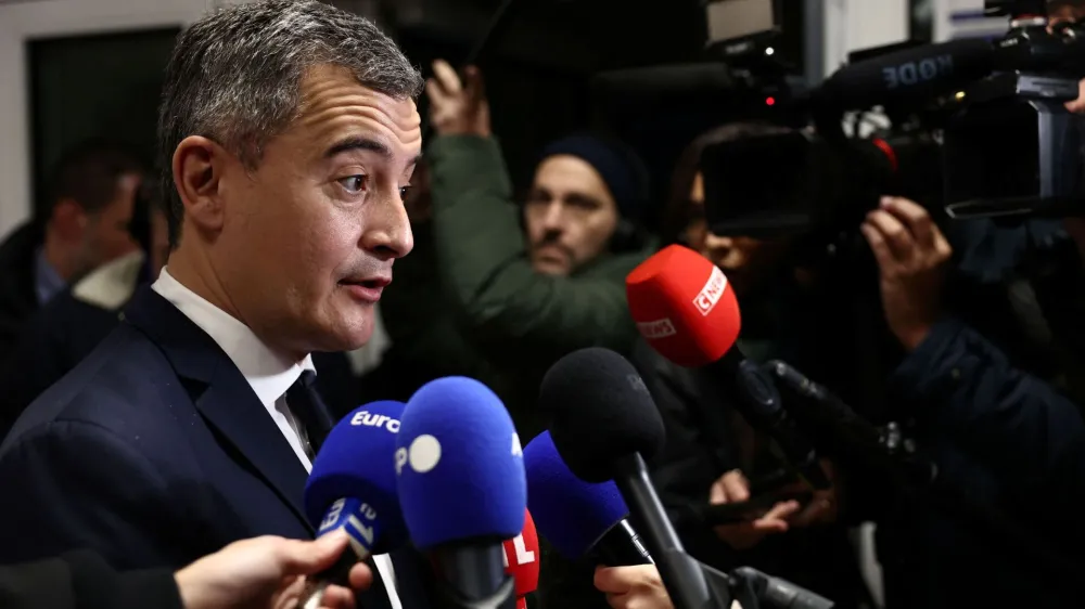 French Interior Minister Gerald Darmanin talks to journalists during a visit at a police station, a day after French lawmakers rejected his immigration bill, in Maisons-Alfort near Paris, France, December 12, 2023. REUTERS/Stephanie Lecocq