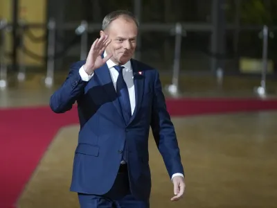 Poland's Prime Minister Donald Tusk arrives for an EU-Western Balkans summit at the European Council building in Brussels, Wednesday, Dec. 13, 2023. European Union and Western Balkans leaders meet in Brussels Wednesday to discuss political and policy engagement, economic foundations and the impact of Russian aggression against Ukraine. (AP Photo/Virginia Mayo)