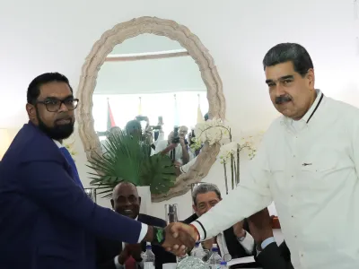 Venezuela's President Nicolas Maduro and Guyanese President Irfaan Ali shake hands as they meet amid tensions over a border dispute, in Kingstown, St. Vincent and the Grenadines December 14, 2023. Miraflores Palace/Handout via REUTERS ATTENTION EDITOR - THIS IMAGE HAS BEEN SUPPLIED BY A THIRD PARTY