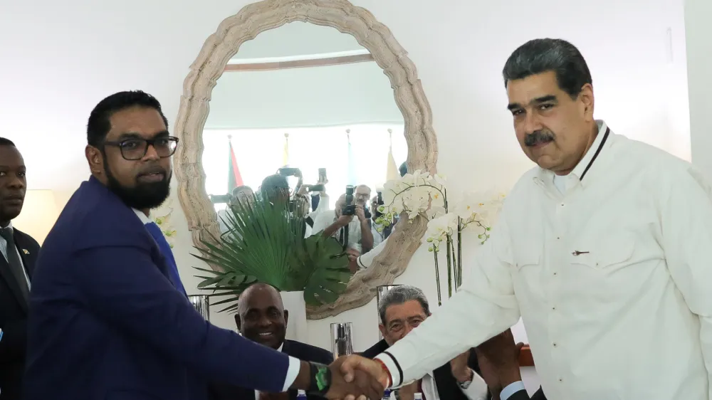 Venezuela's President Nicolas Maduro and Guyanese President Irfaan Ali shake hands as they meet amid tensions over a border dispute, in Kingstown, St. Vincent and the Grenadines December 14, 2023. Miraflores Palace/Handout via REUTERS ATTENTION EDITOR - THIS IMAGE HAS BEEN SUPPLIED BY A THIRD PARTY
