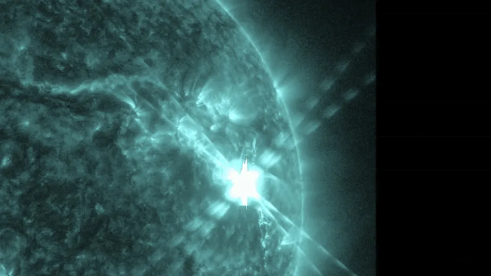 This photo provided by NASA's Solar Dynamics Observatory captured this image of a solar flare, as seen in the bright flash in the upper right, on Thursday, Dec. 14, 2023. The sun spit out the huge flare at noon on Thursday, resulting in two hours of radio interference in the U.S. and other sunlit parts of the world. (NASA via AP)